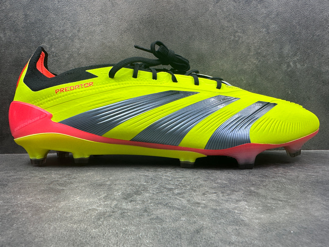 A pair of Adidas Predator Elite FG soccer cleats in bright green color with black and gray accents, featuring a string bag.